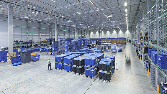 A bird's eye view of a large warehouse with load carriers.
